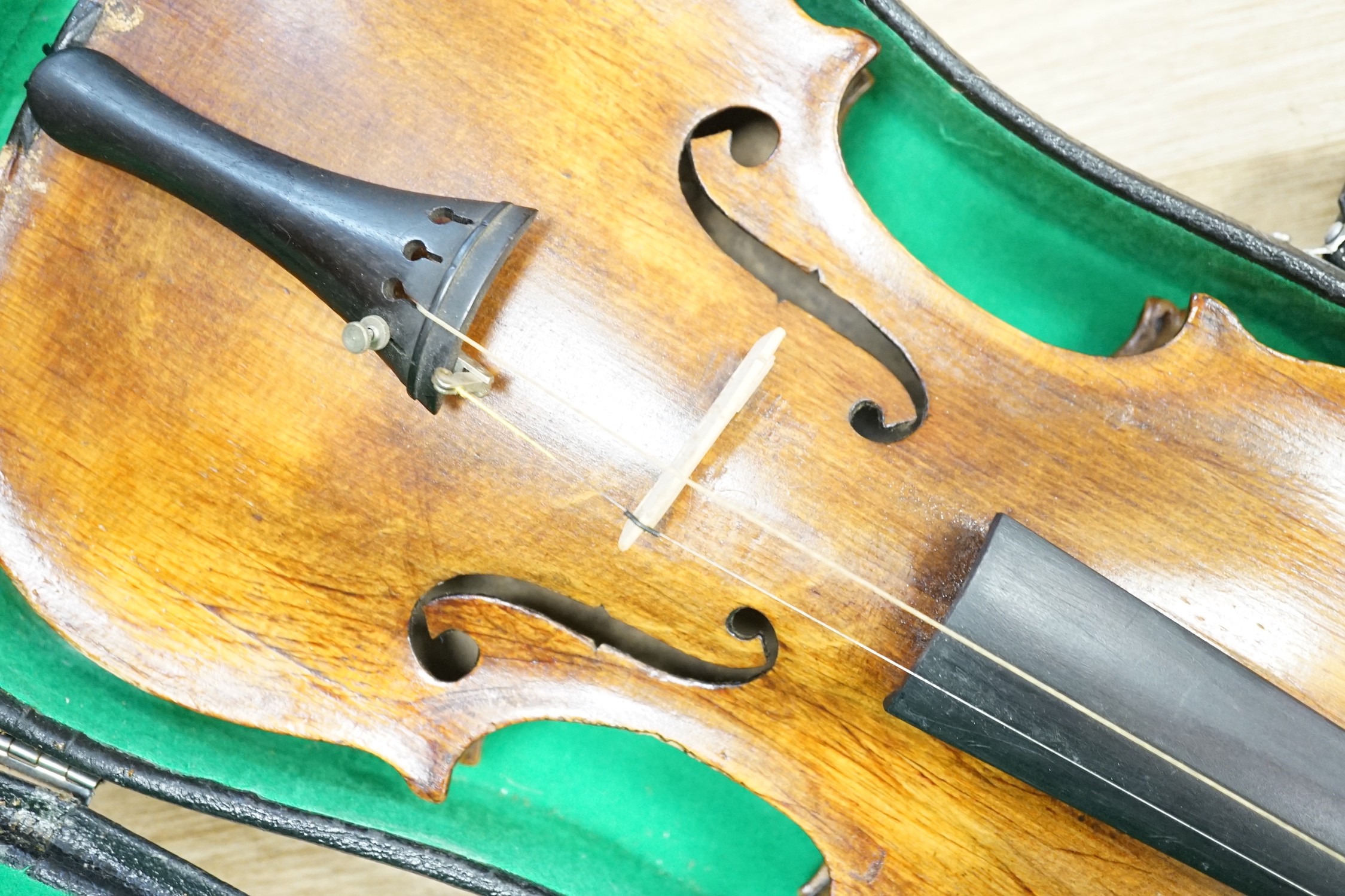 A cased violin. Label inside reads Copie de Pietro Antonius Dallas Costa fec in Treviso anno 17
